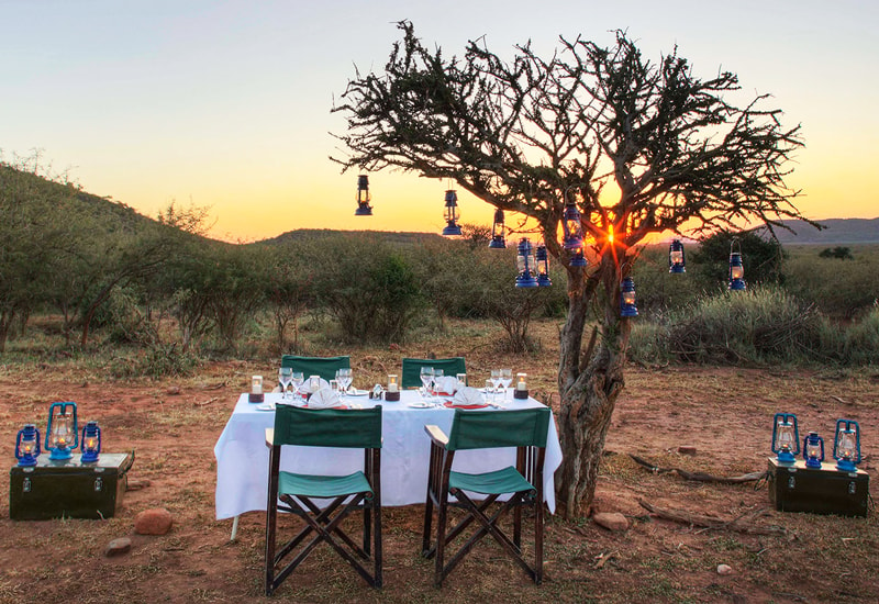 Bush dinner experience at Rhulani Safari Lodge as the sun sets. 