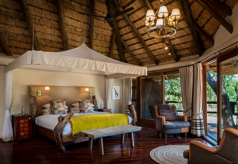 main four post bed in suite at ulusaba safari lodge