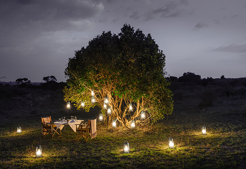 Outdoor dinner at Sanctuary Olonana great migration lodges