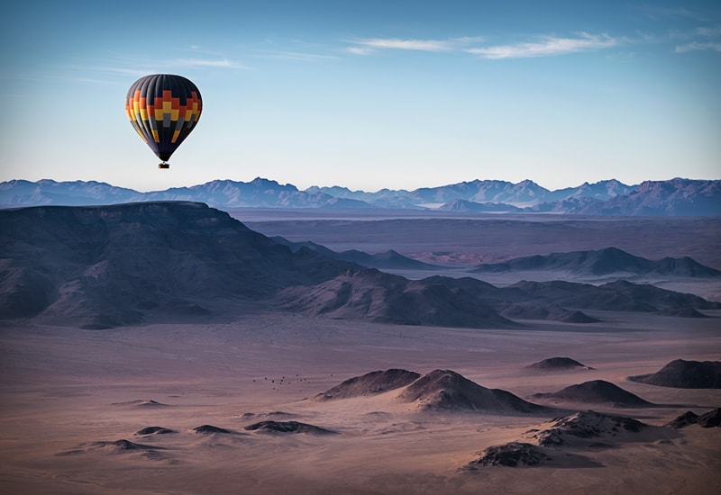 Hot air balloon gliding over the Sossusvlei Desert