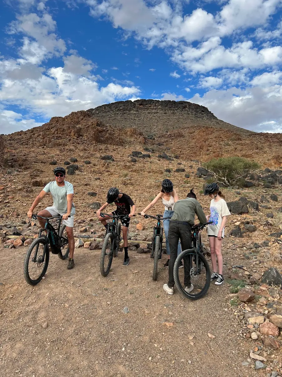 Our UK guests traveled by private flights from Windhoek to Sossusvlei and Swakopmund. At &Beyond Sossusvlei Desert Lodge, they enjoyed stunning desert views, cycling, quad biking, and the rare sight of desert rain—the first in 10 years